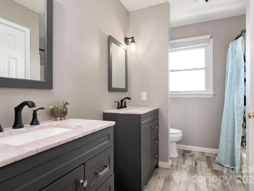 58 Braddock Way, Asheville, NC 28803.  MLS# CAR4246877, YatesRealty ID 17643. Guest Bathroom with Double Vanity