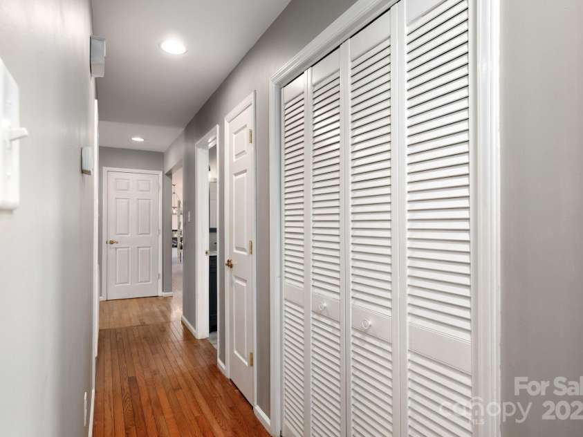 58 Braddock Way, Asheville, NC 28803.  MLS# CAR4246877, YatesRealty ID 17643. Walkway to Bedrooms and Linen Closet