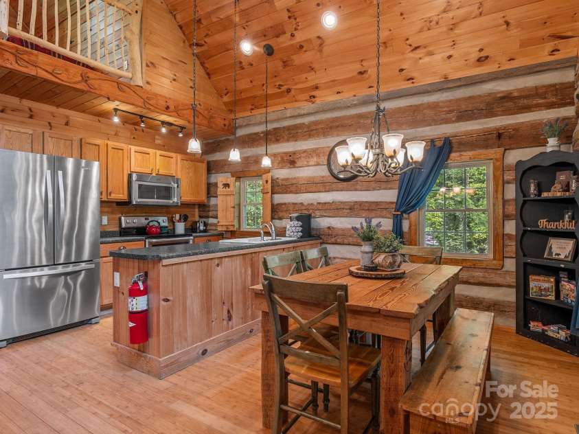 18 Lennox Road, Landrum, SC 29356.  MLS# CAR4253831, YatesRealty ID 17646. Kitchen and dining area.