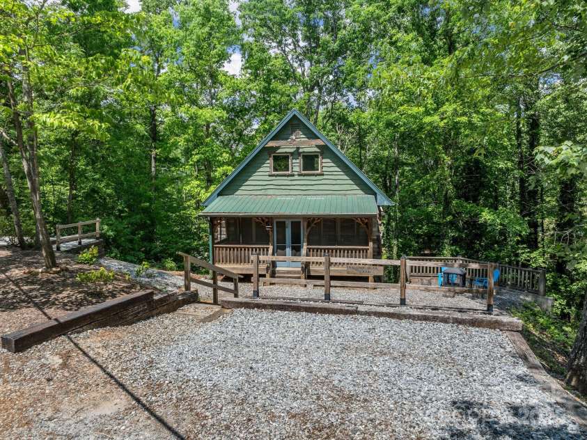 18 Lennox Road, Landrum, SC 29356.  MLS# CAR4253831, YatesRealty ID 17646. One of two parking areas that lead to this cabin tucked in the trees.