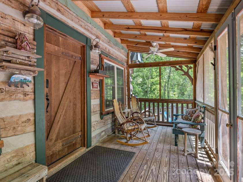 18 Lennox Road, Landrum, SC 29356.  MLS# CAR4253831, YatesRealty ID 17646. Spend lazy evenings rocking on the screened porch.