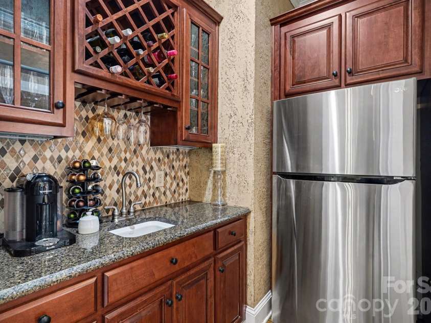 7609 Windaliere Drive, Cornelius, NC 28031.  MLS# CAR4358973, YatesRealty ID 17651. Off-Kitchen Scullery with extra cabinetry and refrigerator