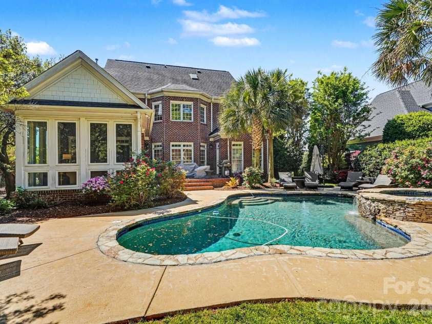 7609 Windaliere Drive, Cornelius, NC 28031.  MLS# CAR4358973, YatesRealty ID 17651. Relax in backyard Oasis