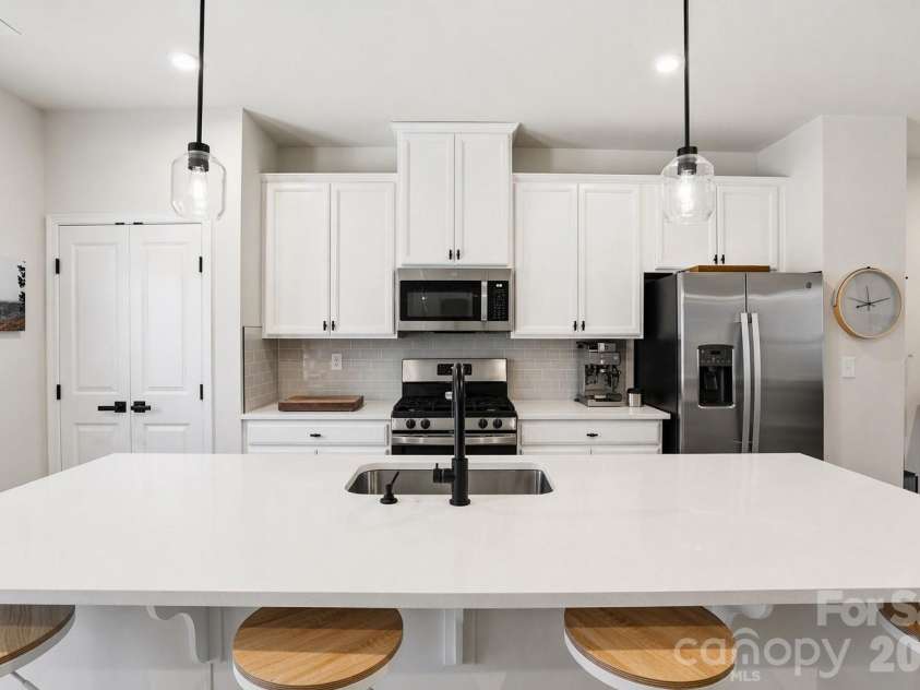 1311 Ashbury Street, Charlotte, NC 28216.  MLS# CAR4370240, YatesRealty ID 17660. Eat-in Kitchen - Frost White Quartz  Countertops + Delta Trinsic Faucet