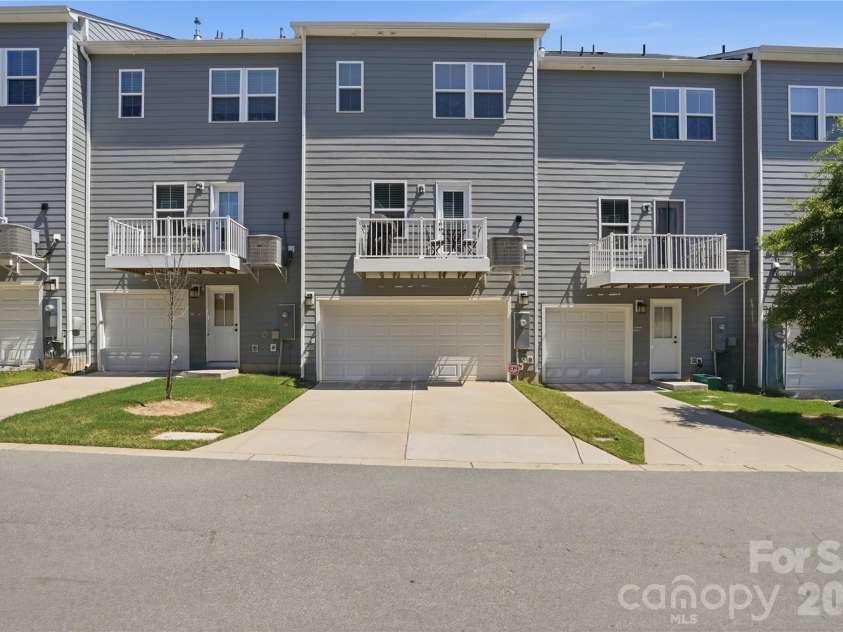 1311 Ashbury Street, Charlotte, NC 28216.  MLS# CAR4370240, YatesRealty ID 17660. Two Car Garage + Full Driveway