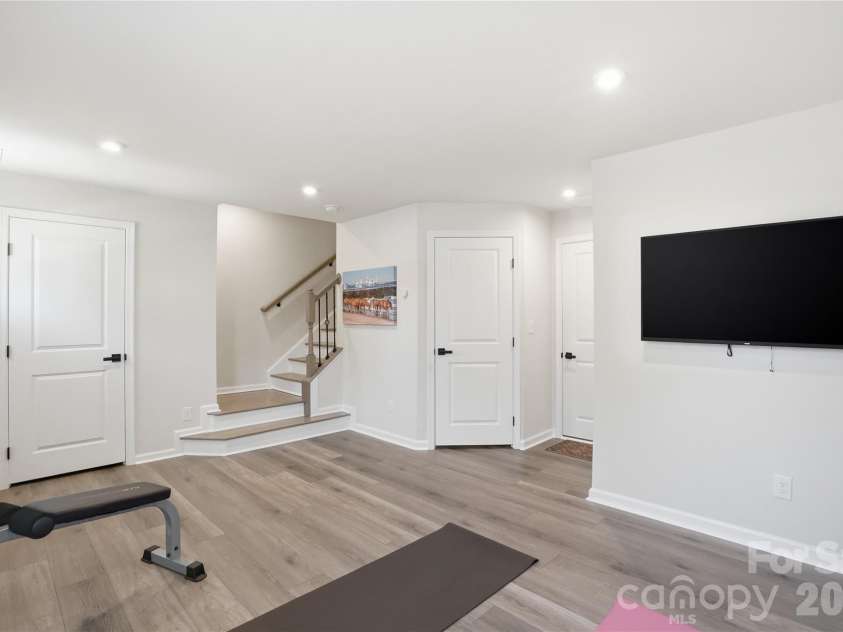 1311 Ashbury Street, Charlotte, NC 28216.  MLS# CAR4370240, YatesRealty ID 17660. Vinyl Plank Flooring - Oak Wood Stairs