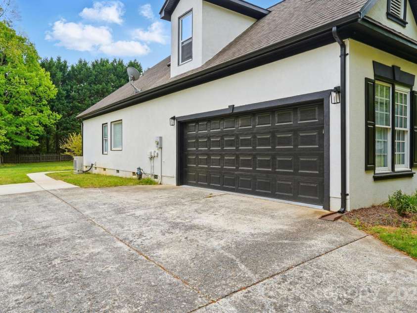 530 Dovefield Drive, Indian Trail, NC 28079.  MLS# CAR4246634, YatesRealty ID 17665. Side Load Garage With Extended Driveway