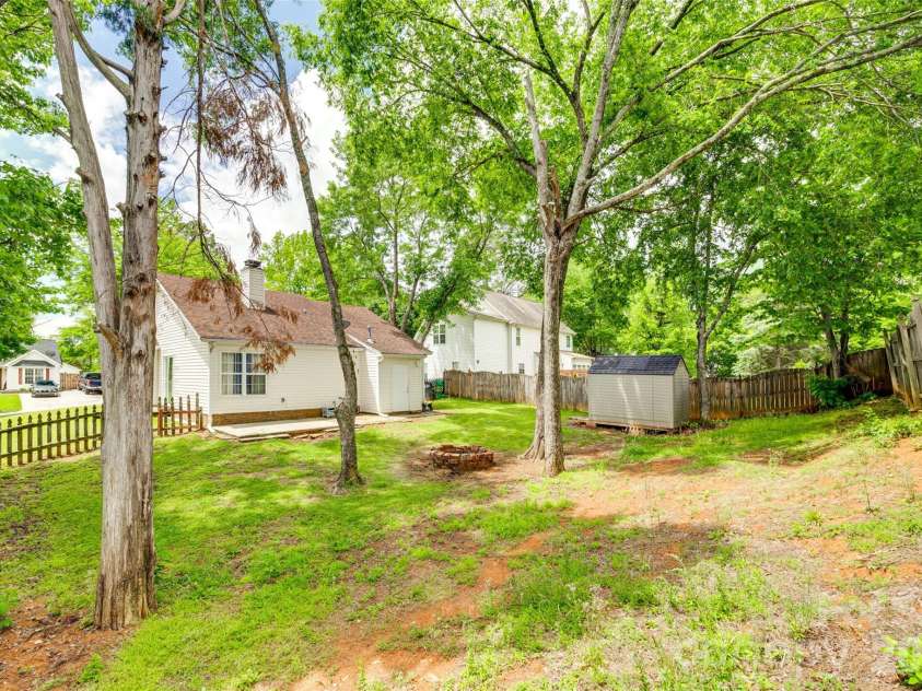 7442 Crestside Lane, Charlotte, NC 28227.  MLS# CAR4373229, YatesRealty ID 17666. Mature trees