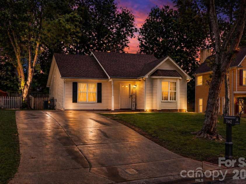 7442 Crestside Lane, Charlotte, NC 28227.  MLS# CAR4373229, YatesRealty ID 17666. Twilight (AI) front view