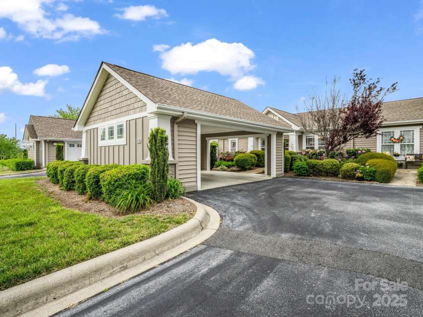 5802 Wood Duck Way, Hendersonville, NC 28792.  MLS# CAR4251219, YatesRealty ID 17674. Carport