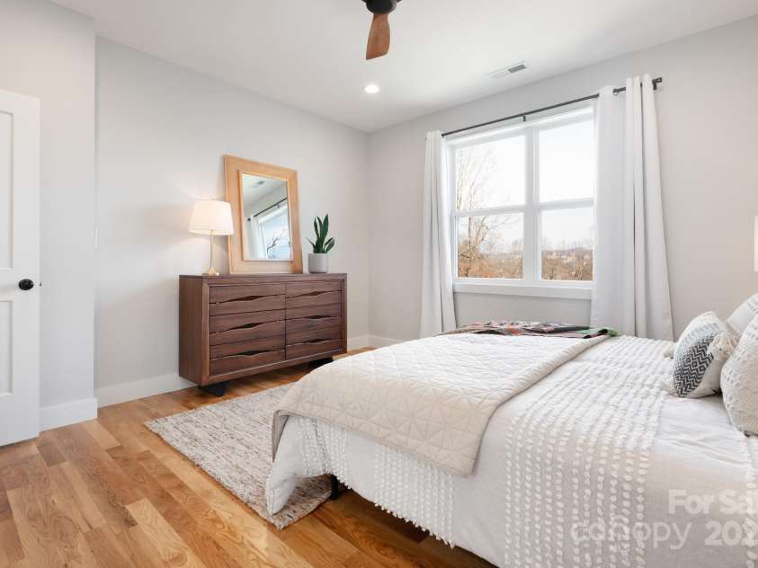20 Tahkieostie Trail, Asheville, NC 28806.  MLS# CAR4221913, YatesRealty ID 17675. City and mountain views from primary bedroom