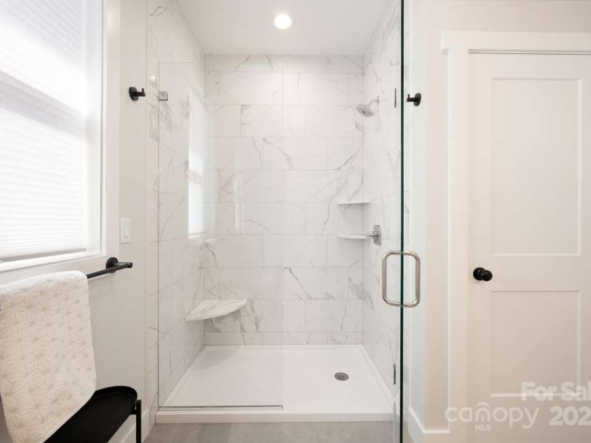 20 Tahkieostie Trail, Asheville, NC 28806.  MLS# CAR4221913, YatesRealty ID 17675. Primary bedroom ensuite bathroom tiled shower