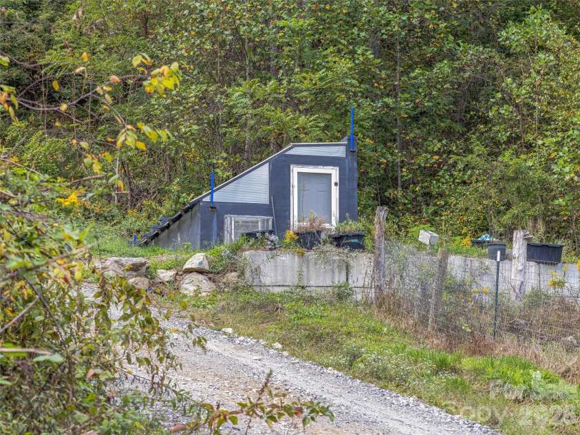 945 Roaring Fork Road, Hot Springs, NC 28743.  MLS# CAR4307267, YatesRealty ID 17678. Climate controlled greenhouse