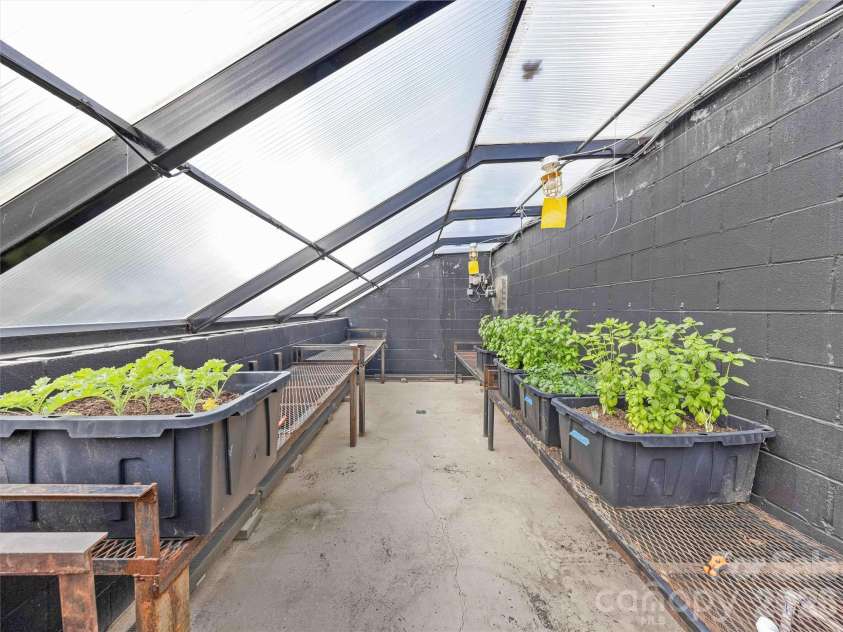 945 Roaring Fork Road, Hot Springs, NC 28743.  MLS# CAR4307267, YatesRealty ID 17678. Climate controlled greenhouse