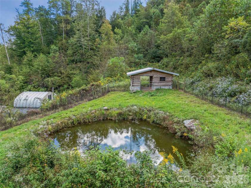 945 Roaring Fork Road, Hot Springs, NC 28743.  MLS# CAR4307267, YatesRealty ID 17678. Pond and goat house