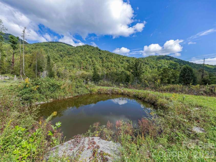 945 Roaring Fork Road, Hot Springs, NC 28743.  MLS# CAR4307267, YatesRealty ID 17678. Pond and mountain views
