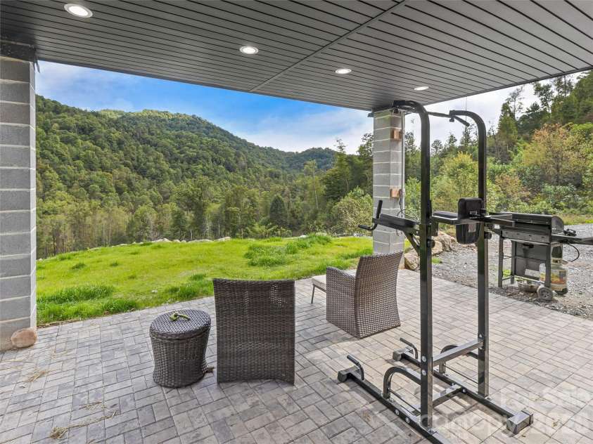 945 Roaring Fork Road, Hot Springs, NC 28743.  MLS# CAR4307267, YatesRealty ID 17678. Posts have since been wrapped with river stove