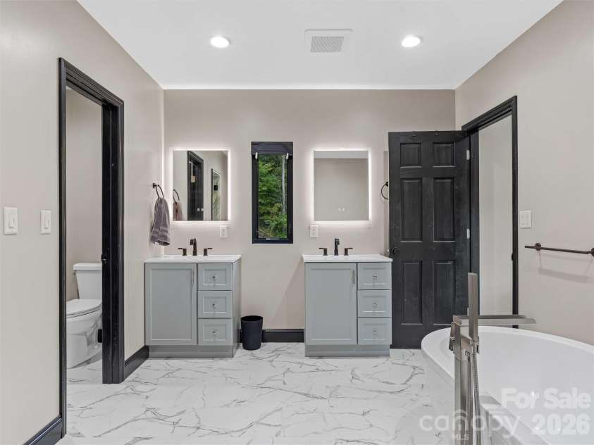 945 Roaring Fork Road, Hot Springs, NC 28743.  MLS# CAR4307267, YatesRealty ID 17678. Primary bathroom