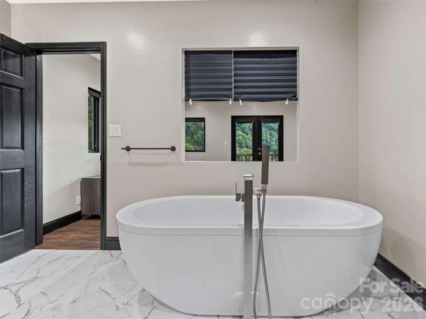 945 Roaring Fork Road, Hot Springs, NC 28743.  MLS# CAR4307267, YatesRealty ID 17678. Primary bathroom