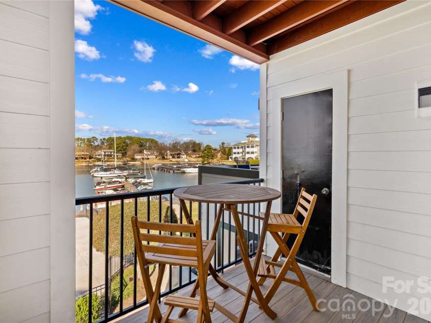 18729 Vineyard Point Lane, Cornelius, NC 28031.  MLS# CAR4344538, YatesRealty ID 17687. Balcony overlooking the pool and Lake Norman