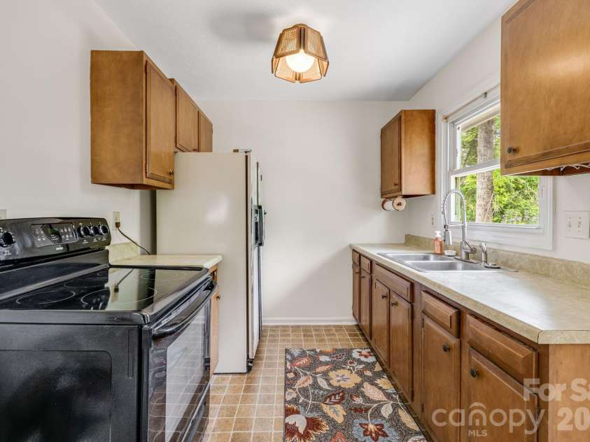 18 Compton Drive, Asheville, NC 28806.  MLS# CAR4343656, YatesRealty ID 17688. Galley style kitchen