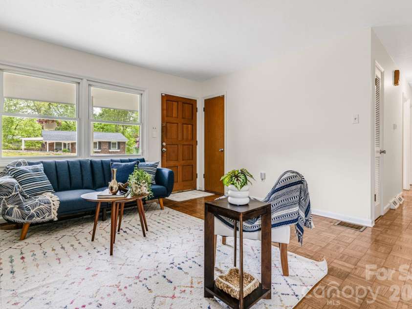 18 Compton Drive, Asheville, NC 28806.  MLS# CAR4343656, YatesRealty ID 17688. Living area looking toward front entry