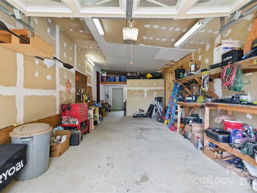 33 Faholoa Ridge Road, Black Mountain, NC 28711.  MLS# CAR4263286, YatesRealty ID 17690. Garage interior