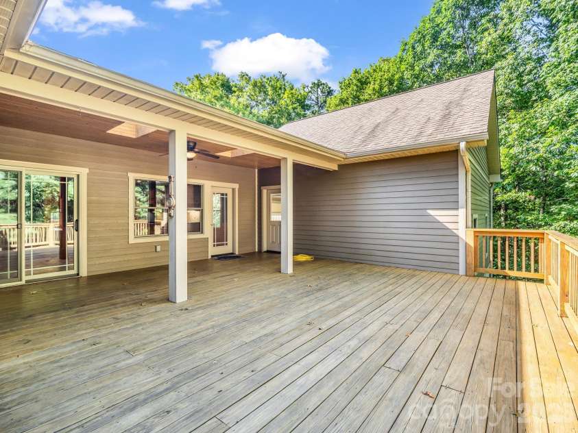 82 Red Mulberry Drive, Zirconia, NC 28790.  MLS# CAR4363684, YatesRealty ID 17694. Partially covered back deck