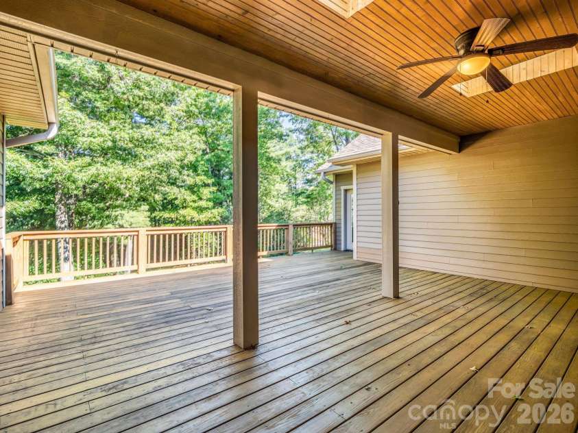 82 Red Mulberry Drive, Zirconia, NC 28790.  MLS# CAR4363684, YatesRealty ID 17694. Partially covered back deck