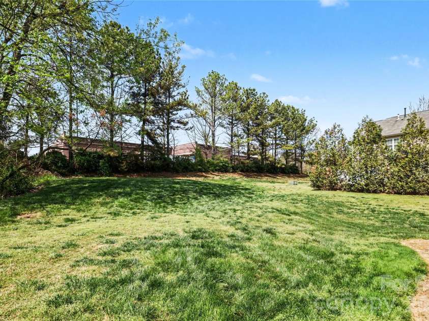 152 Charterhouse Lane, Fort Mill, SC 29715.  MLS# CAR4419693, YatesRealty ID 17696. Home backs to a large common area