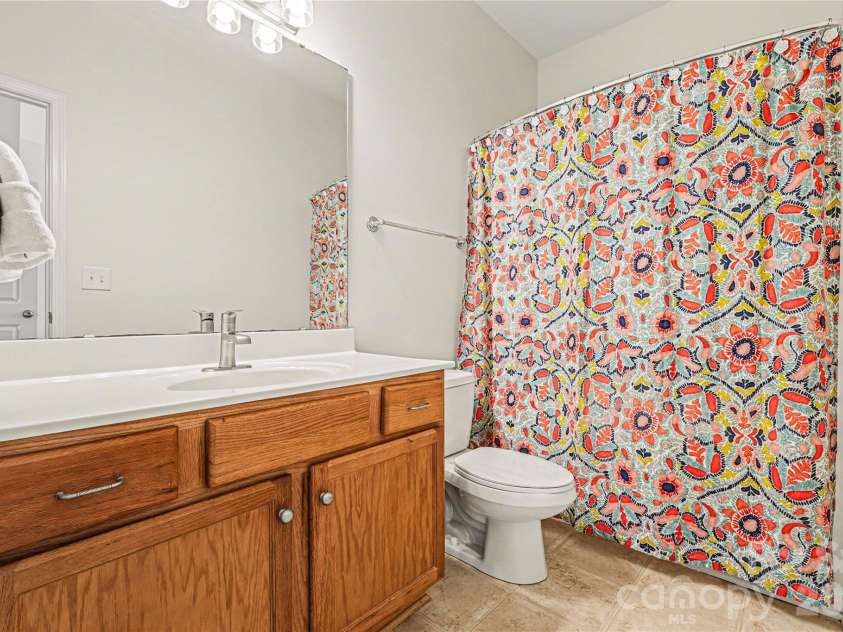 152 Charterhouse Lane, Fort Mill, SC 29715.  MLS# CAR4419693, YatesRealty ID 17696. Primary bath features a tub/shower combo, updated lighting and so much storage