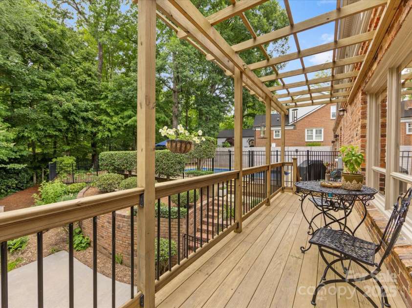 3225 Mill Pond Road, Charlotte, NC 28226.  MLS# CAR4263953, YatesRealty ID 17700. Deck off family room overlooking private back yard