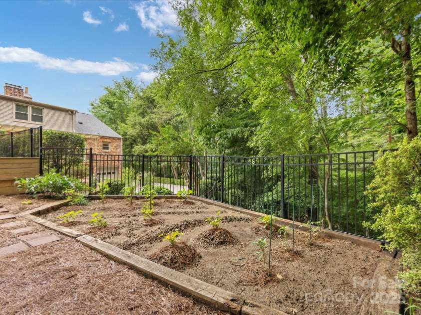 3225 Mill Pond Road, Charlotte, NC 28226.  MLS# CAR4263953, YatesRealty ID 17700. Garden behind the pool