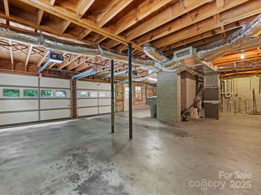 3225 Mill Pond Road, Charlotte, NC 28226.  MLS# CAR4263953, YatesRealty ID 17700. Large basement garage