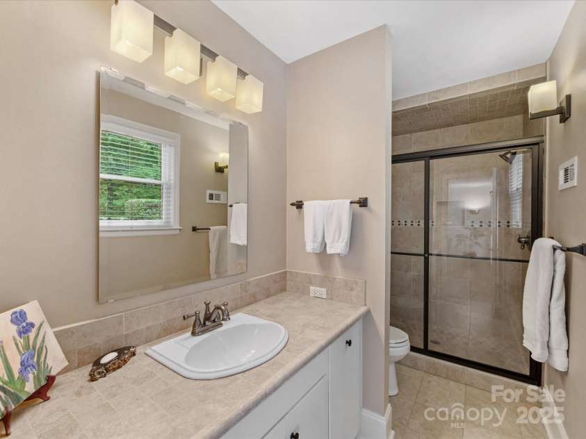 3225 Mill Pond Road, Charlotte, NC 28226.  MLS# CAR4263953, YatesRealty ID 17700. Primary bedroom with walk-in shower
