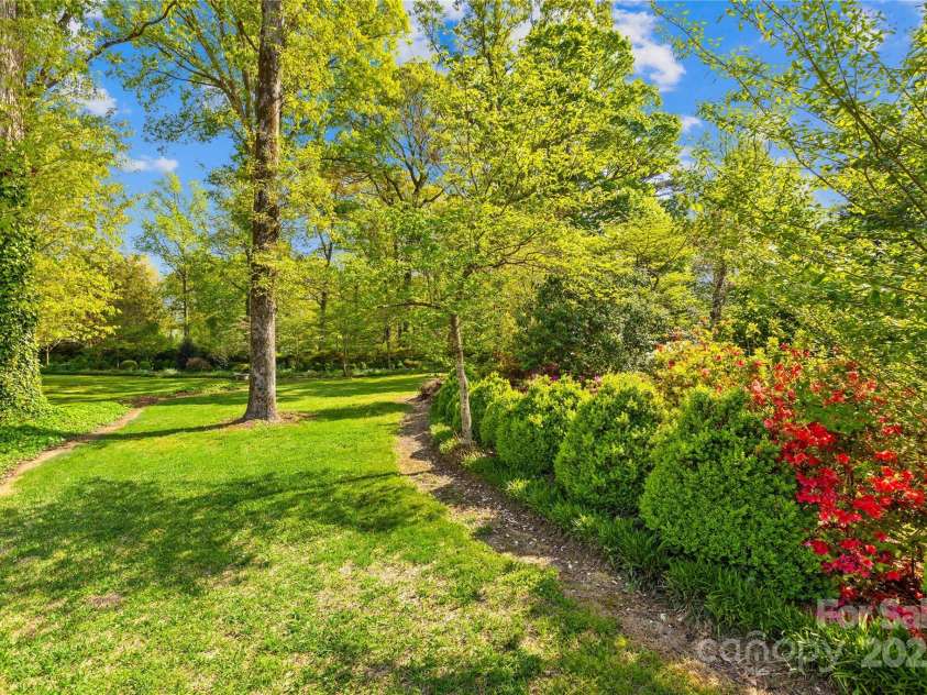 4896 Pageland Highway, Lancaster, SC 29720.  MLS# CAR4246067, YatesRealty ID 17701. LUSH landscaped gardens