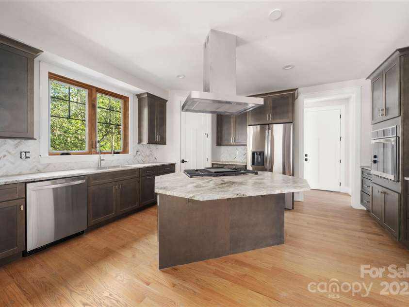 29 Wild Deer Trail, Zirconia, NC 28790.  MLS# CAR4243690, YatesRealty ID 17702. Kitchen with granite counter tops and stainless steel appliances