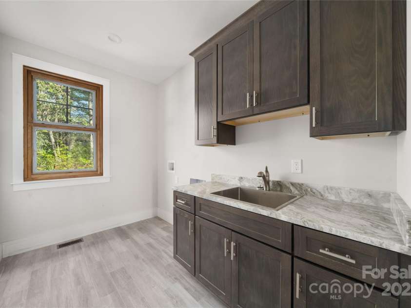 29 Wild Deer Trail, Zirconia, NC 28790.  MLS# CAR4243690, YatesRealty ID 17702. Laundry room on main level
