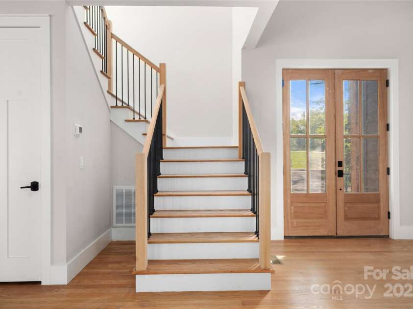 29 Wild Deer Trail, Zirconia, NC 28790.  MLS# CAR4243690, YatesRealty ID 17702. Wood stairs to upper level