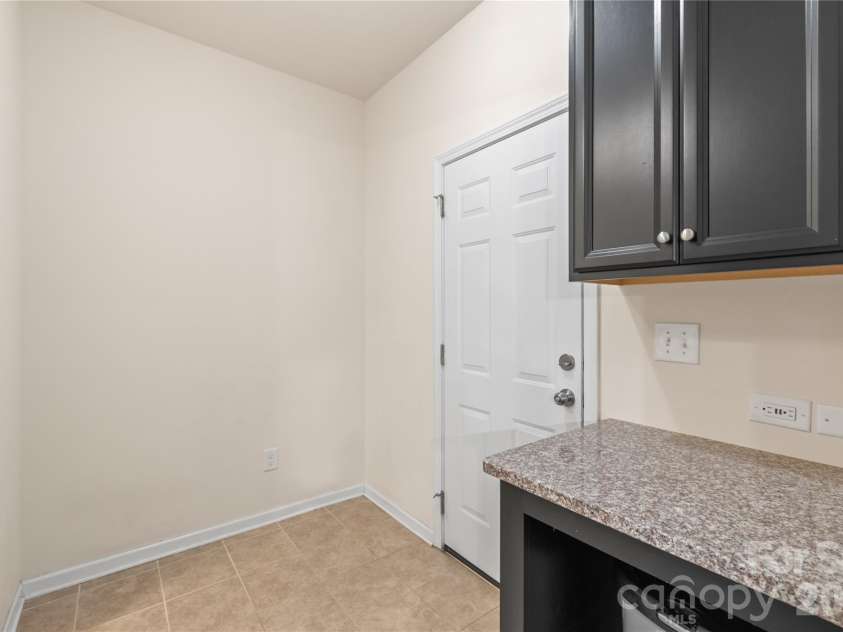 634 Gardenbrook Trail, Belmont, NC 28012.  MLS# CAR4302060, YatesRealty ID 17707. Keep clutter at bay with a functional drop zone right off the garage, equipped with ample cabinet storage.