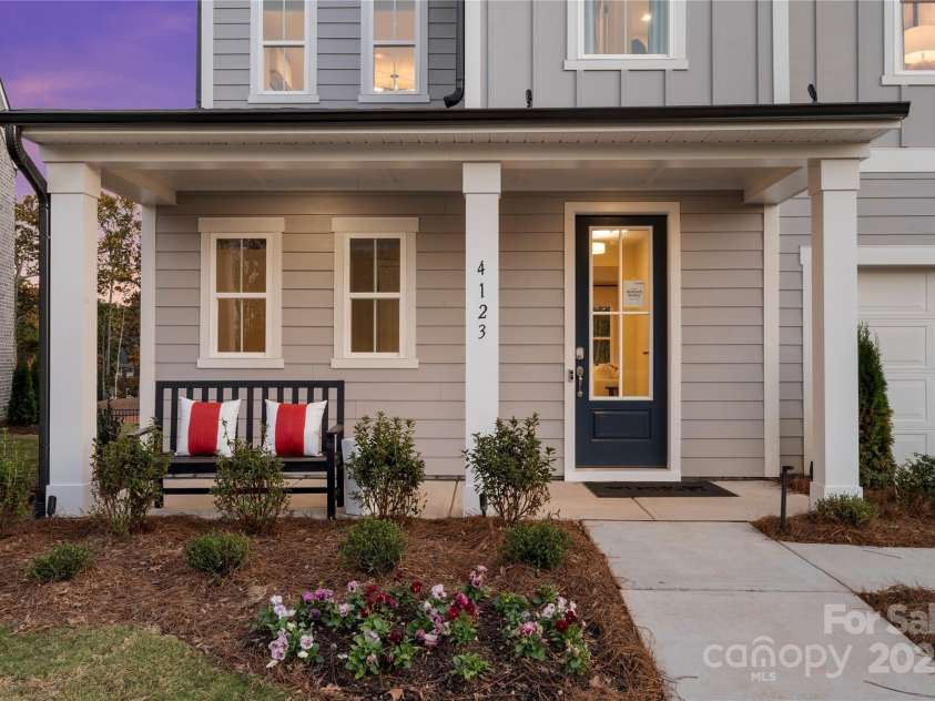 7101 Short Stirrup Lane, Mint Hill, NC 28227.  MLS# CAR4264118, YatesRealty ID 17710. Covered front entry and outdoor living space, ideal for morning coffee or sunset views. *actual finishes, structural selections, and orientation may vary.