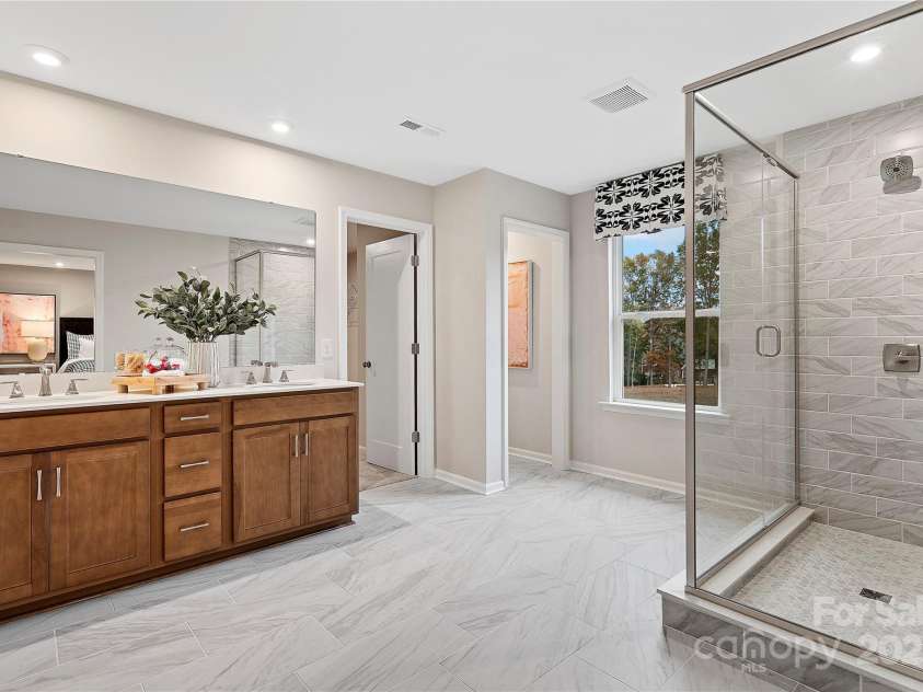 7101 Short Stirrup Lane, Mint Hill, NC 28227.  MLS# CAR4264118, YatesRealty ID 17710. Stunning and modern, this space is complete with oversized floor tiles. *actual finishes, structural selections, and orientation may vary.