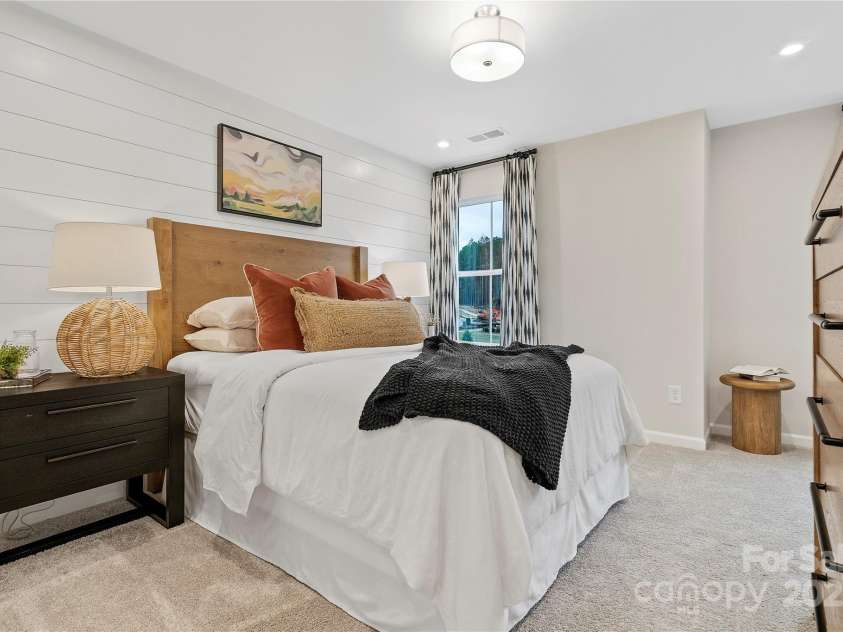 7101 Short Stirrup Lane, Mint Hill, NC 28227.  MLS# CAR4264118, YatesRealty ID 17710. You'll love hosting friends and family in this secondary bedroom. *actual finishes, structural selections, and orientation may vary.