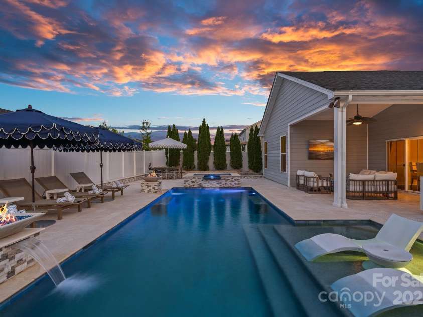 12615 Es Draper Drive, Huntersville, NC 28078.  MLS# CAR4266729, YatesRealty ID 17712. Salt Water pool with fire and water falls