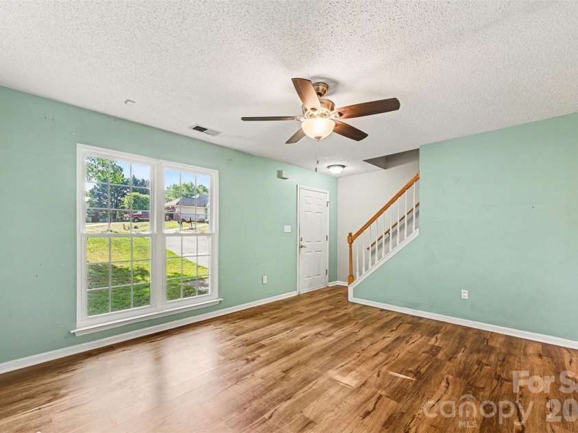 4718 Titus Court, Monroe, NC 28110.  MLS# CAR4373667, YatesRealty ID 17713. Living room and entryway