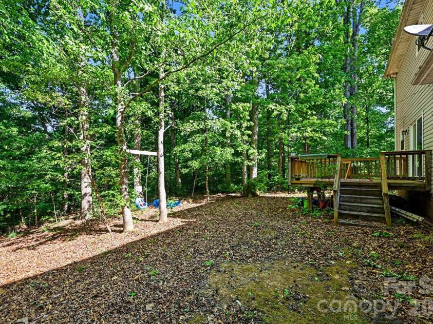 4718 Titus Court, Monroe, NC 28110.  MLS# CAR4373667, YatesRealty ID 17713. Wooded backyard
