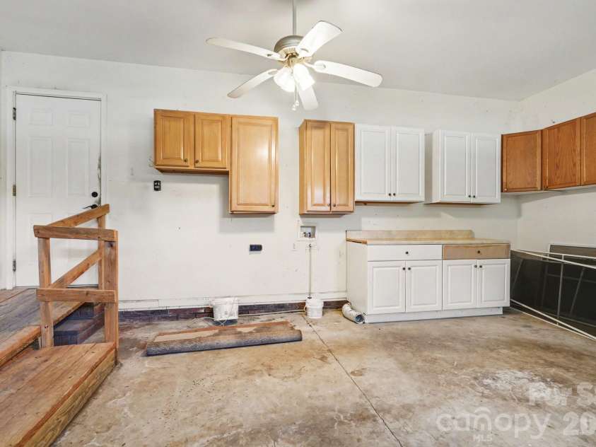 12820 Big Lick Road, Oakboro, NC 28129.  MLS# CAR4374025, YatesRealty ID 17714. Laundry in garage