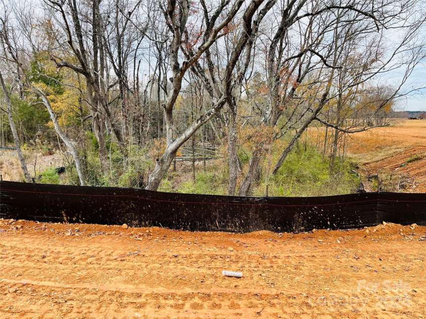 1053 Bull Dog Lane, Wingate, NC 28174.  MLS# CAR4192555, YatesRealty ID 17718. Home backs to trees & pond