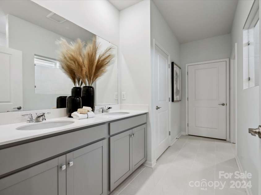 1053 Bull Dog Lane, Wingate, NC 28174.  MLS# CAR4192555, YatesRealty ID 17718. Representational photo of Model Owners bath