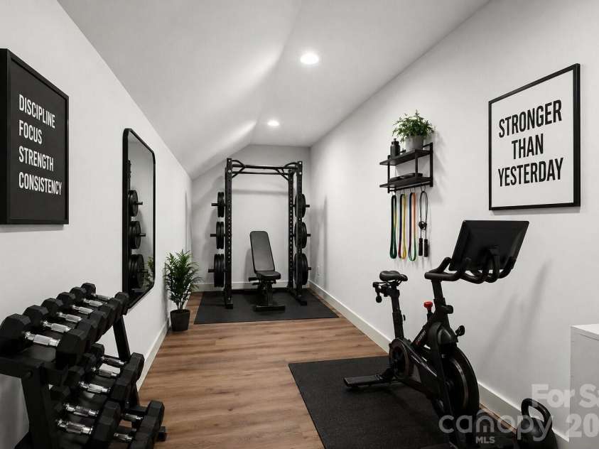 40 Firefly Ridge Trail, Alexander, NC 28701.  MLS# CAR4375434, YatesRealty ID 17720. Virtually Staged gym equipment.